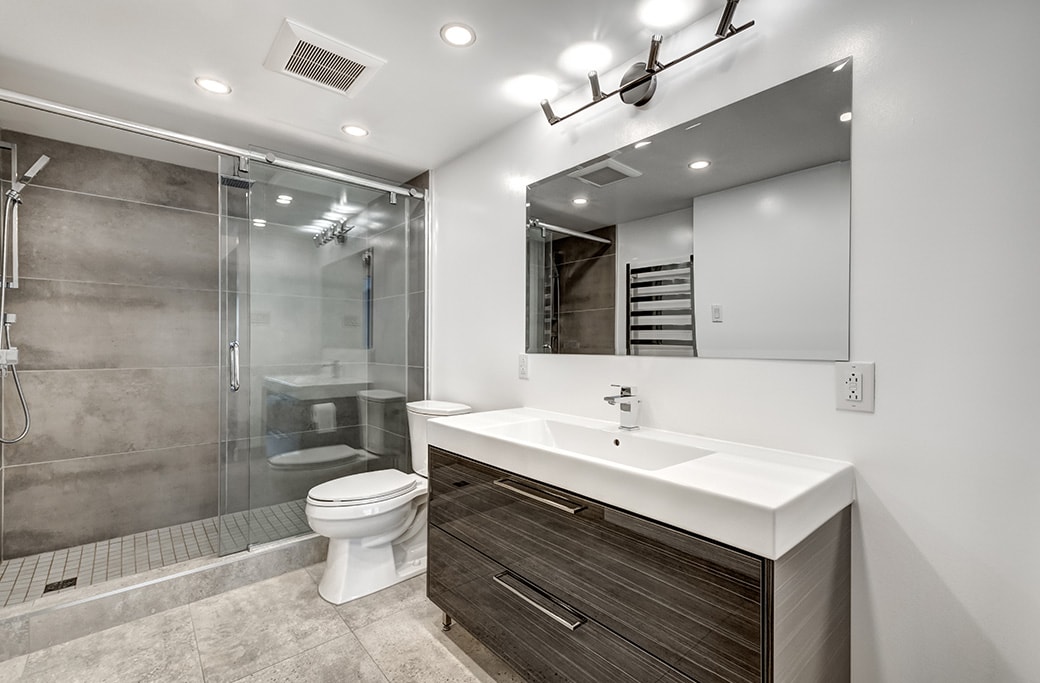 A modern walk in shower showcasing a tub to shower conversion.
