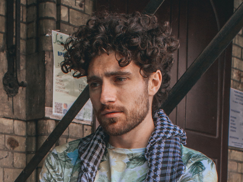 man with controlled messy look curls