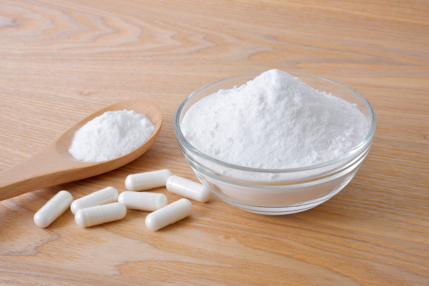 Capsules and a bowl of powder.