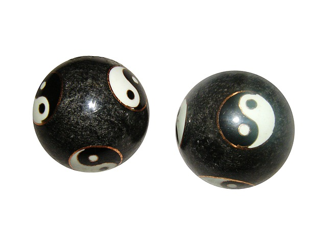 Image by steinchen from Pixabay. Two energy balls with yin-yang symbols on them. 