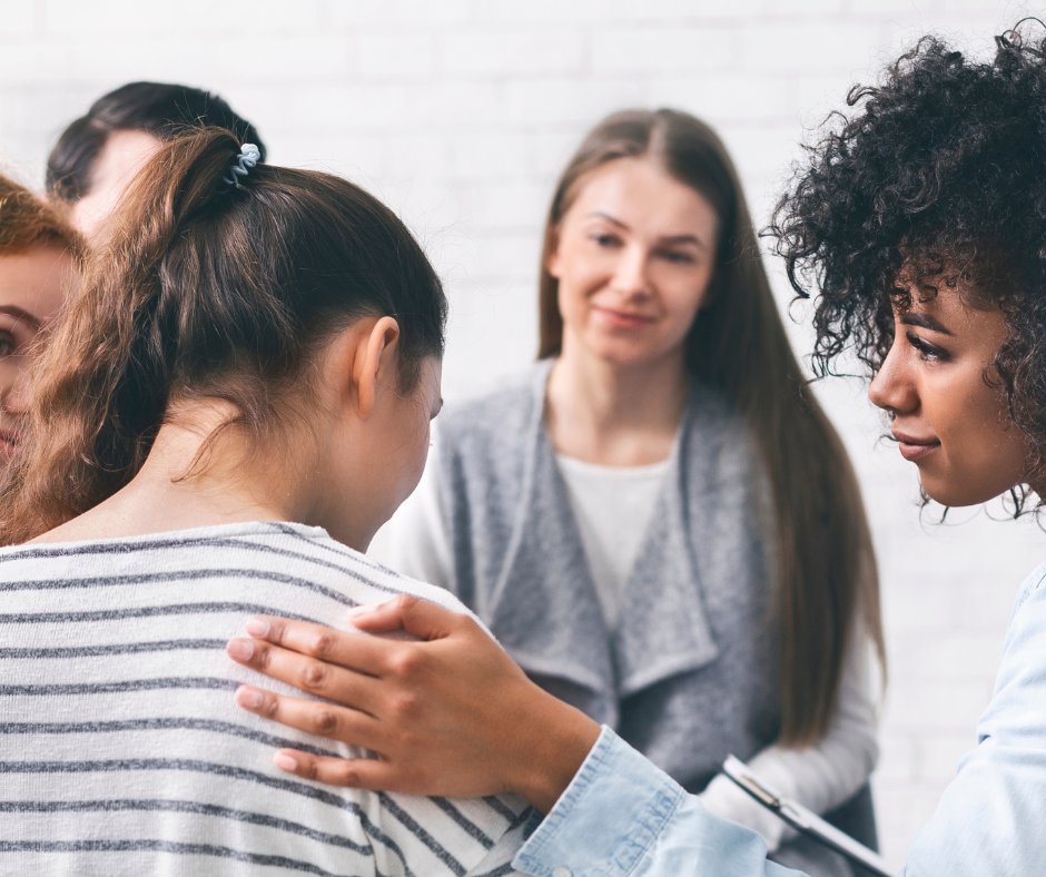 A group of people in a therapy session in a rehab center