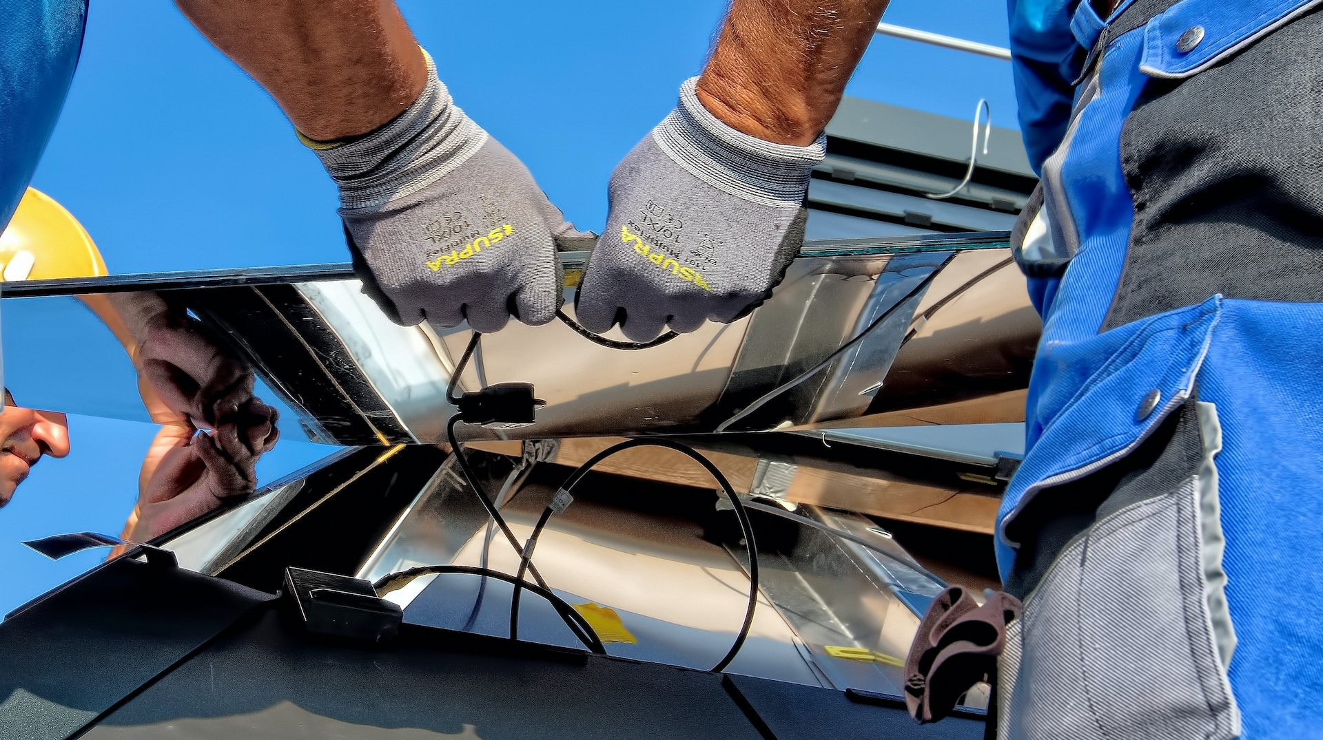 A technician inspecting a solar panel system