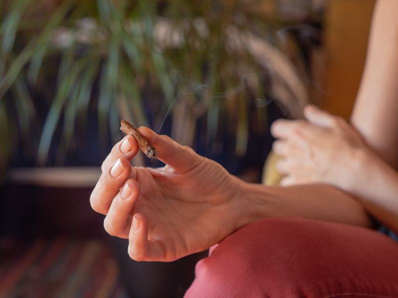 person holding cannabis blunt