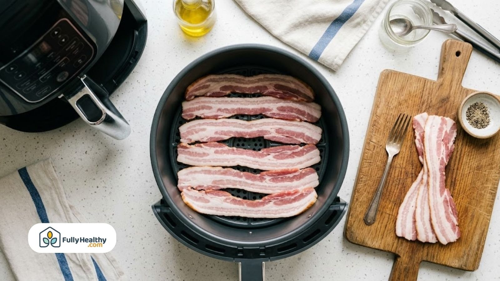 Raw bacon slices arranged in air fryer basket before cooking.