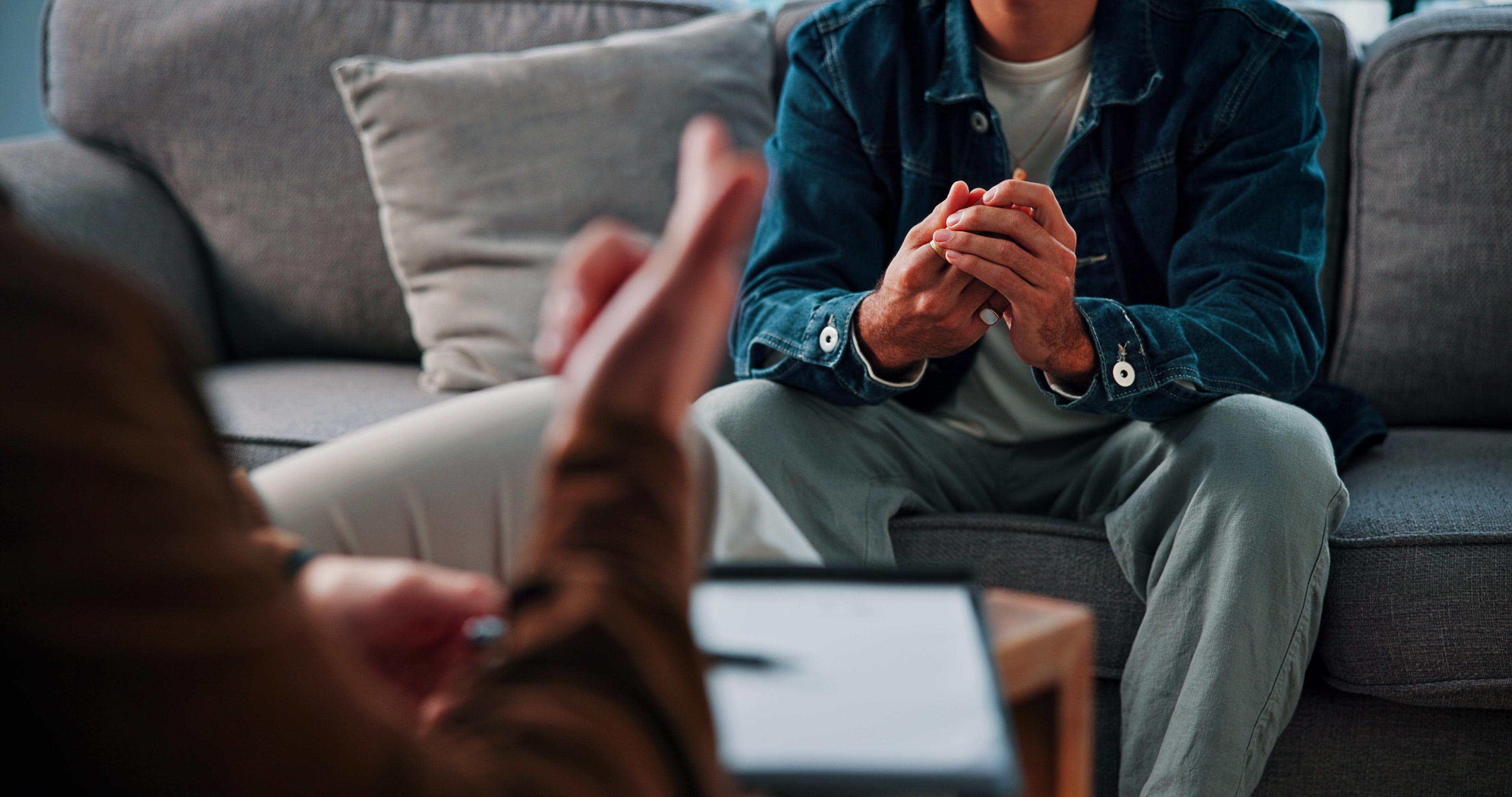 A man talks to his therapy to find out how long does it take to detox from alcohol