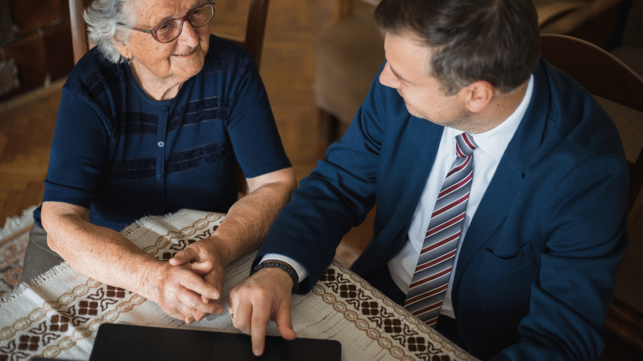 An image of a senior citizen consulting with an experienced lawyer for the elderly regarding Estate Planning