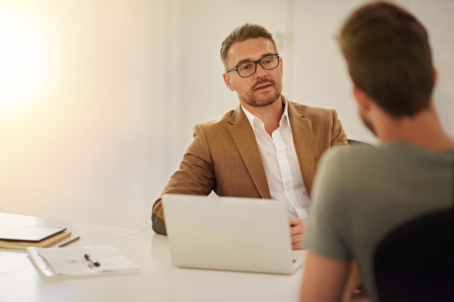 Founder having a talk with an employee.