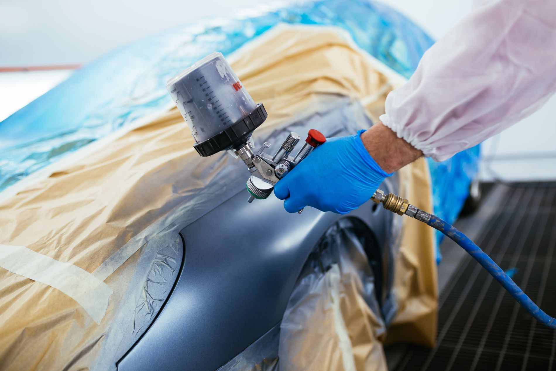 Applying Automotive Paint and touch up paint to paint chips, most quality paint shop processes include lightly sand the body, spray new paint, and apply primer.