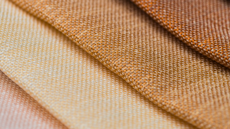 A close up of several different colors of Pima cotton fabric