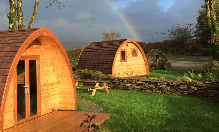 Two Glamping podsin the west cork sunshine with a rainbow in the background