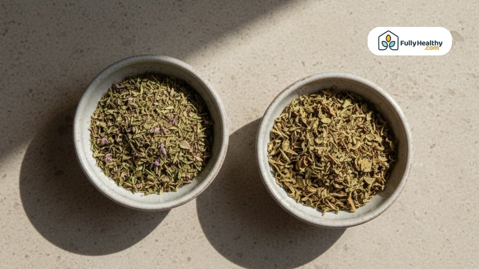 Dried thyme and dried oregano in small ceramic bowls.