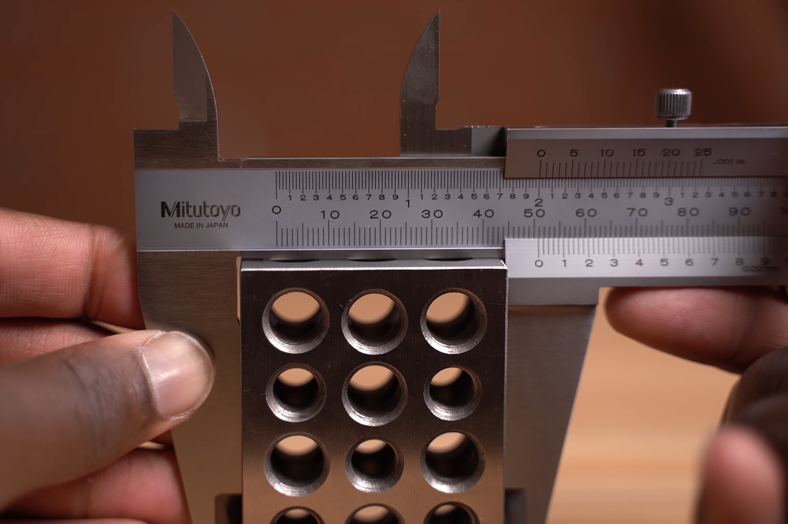 mitutoyo caliper measuring the 2 inch block