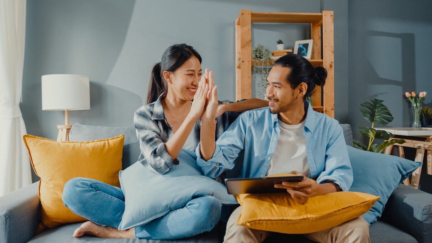 Couple having a "hi-five" moment