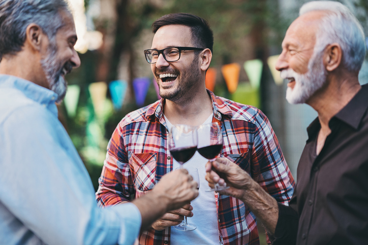 Three men drinking red wine. 