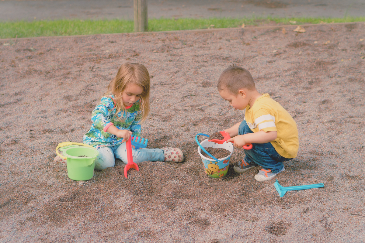 Children playing in the sandbox together