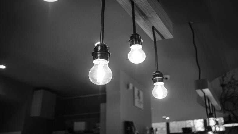 A19 bulbs hanging from a modern ceiling fixture