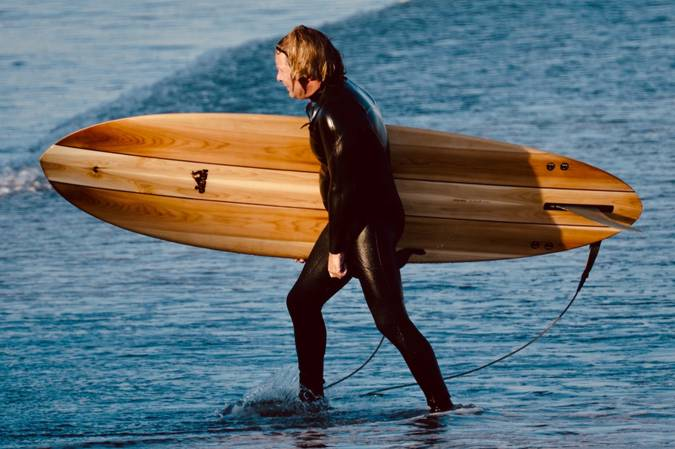 A person holding a solid board