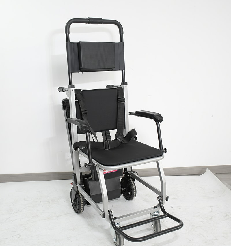 Adjustable medical stair stretcher with a reclining design, cushioned support, and wheeled frame.