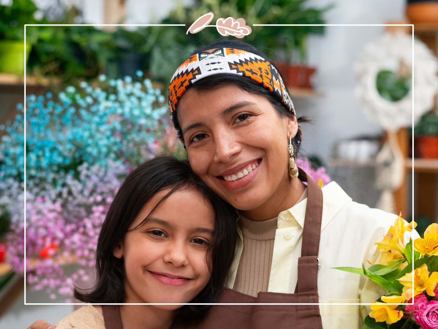 Close-up of smiling mum and daughter with colourful flowers in the background — Fabulous Birthday Wishes for Mom.