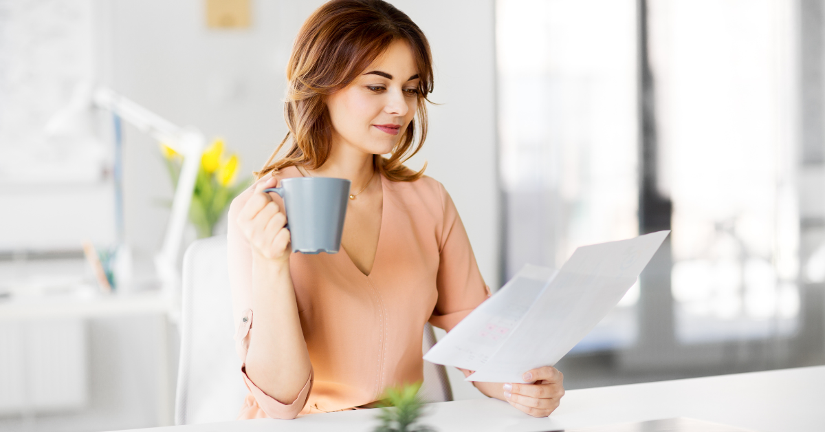 OnlyFans creator working on IRS Form 8995-A at her home office.