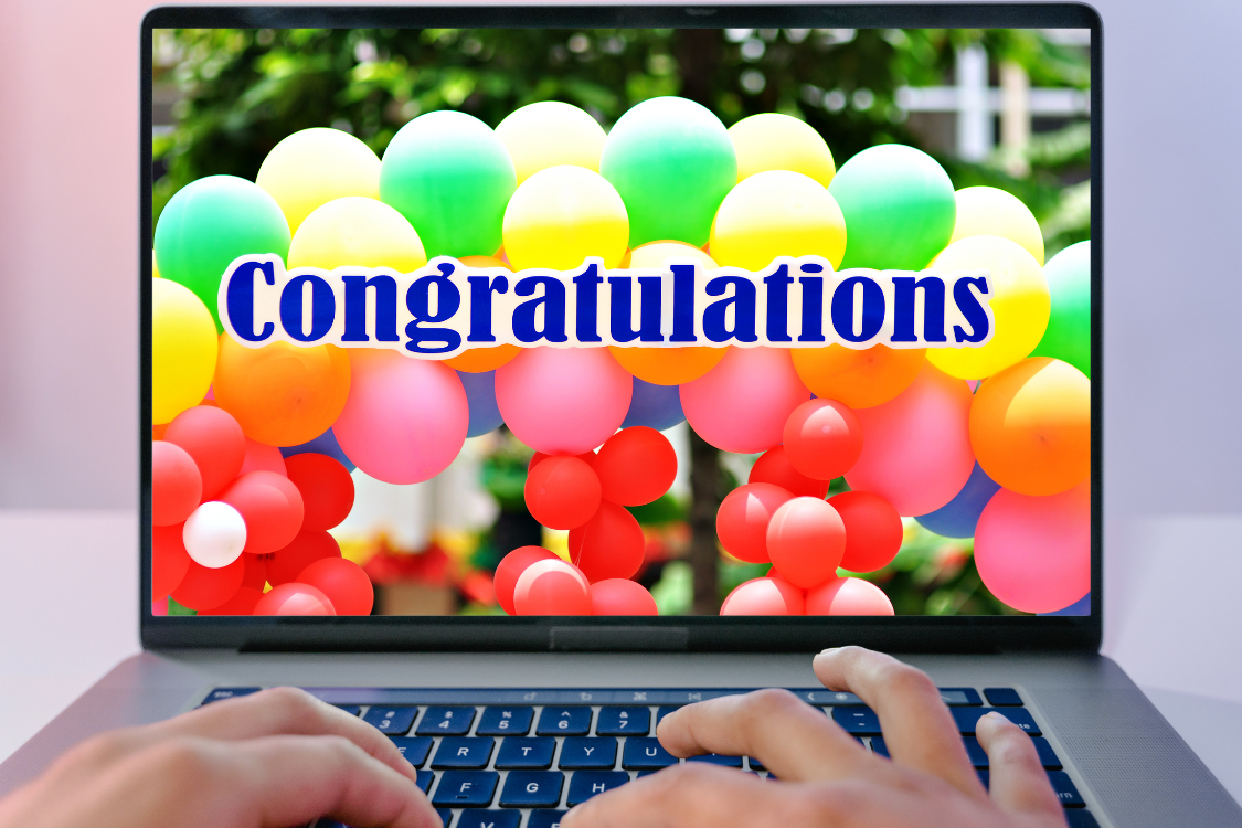 Virtual celebration screen with colorful balloons and "Congratulations" message, symbolizing employee recognition in remote teams.