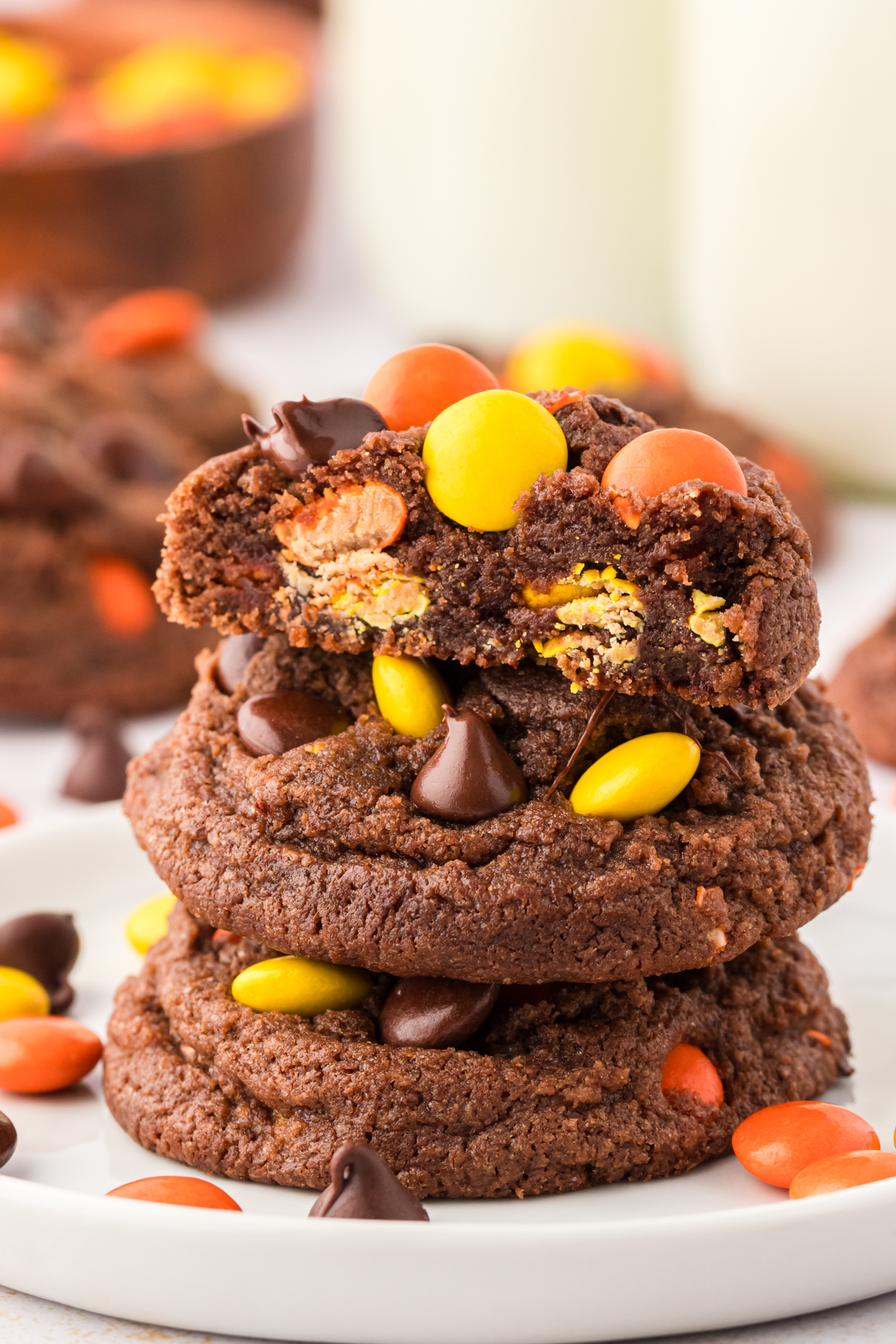 three reese's pieces chocolate cookies on a plate stacked