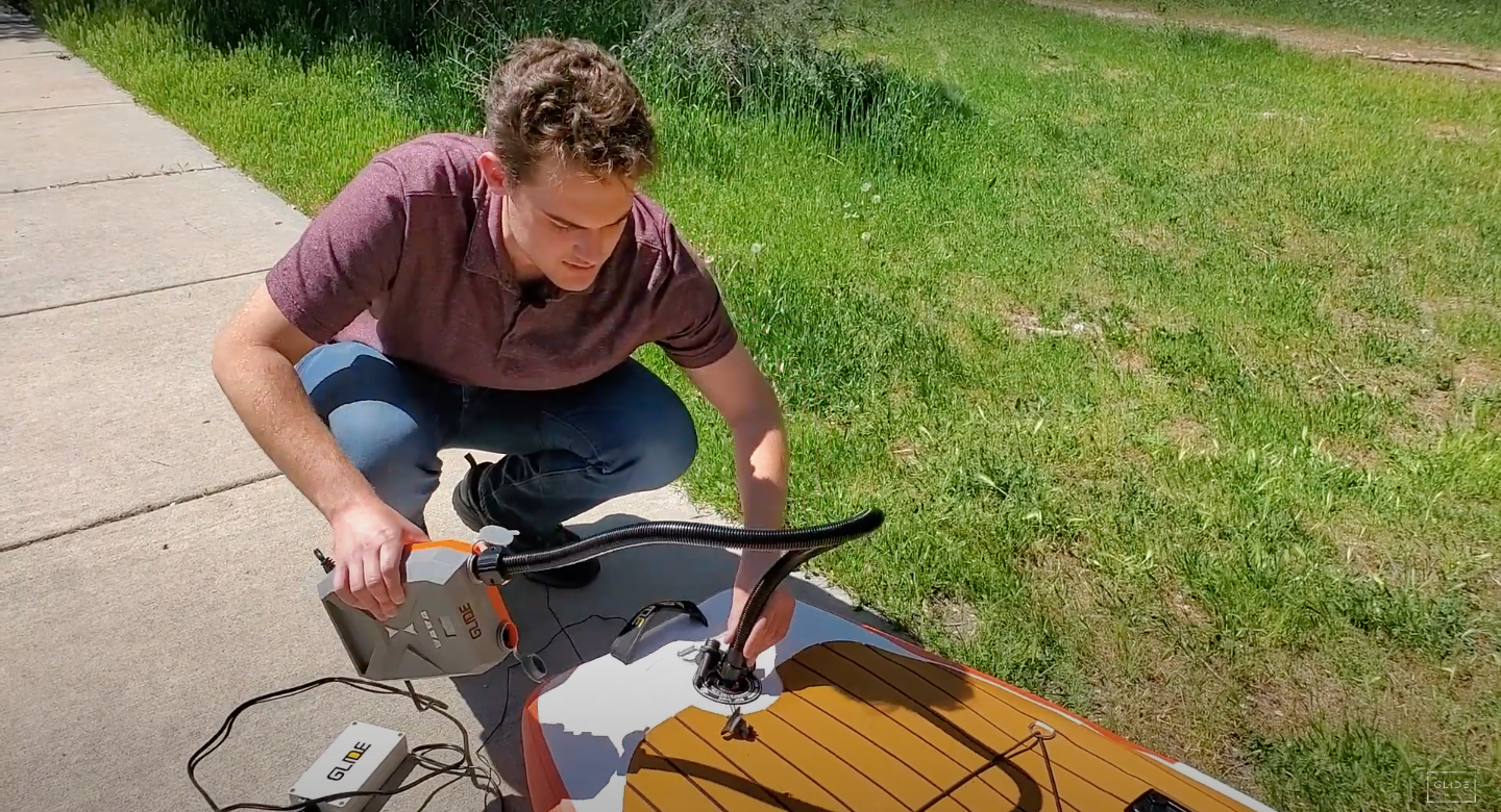 pumping up an inflatable paddle board