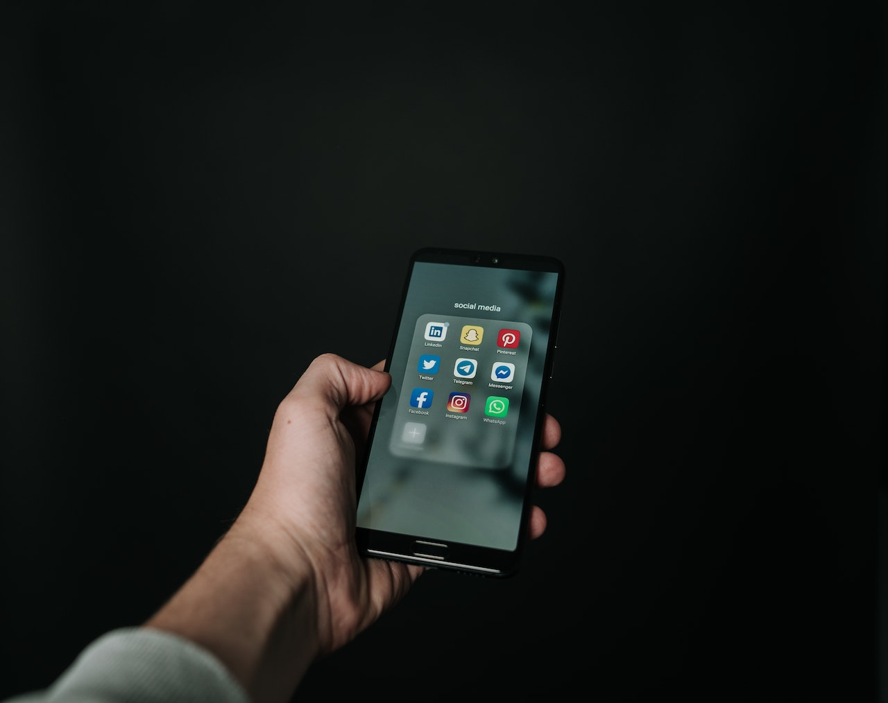 Photo by Magnus Mueller: https://www.pexels.com/photo/photo-of-hand-holding-a-black-smartphone-2818118/