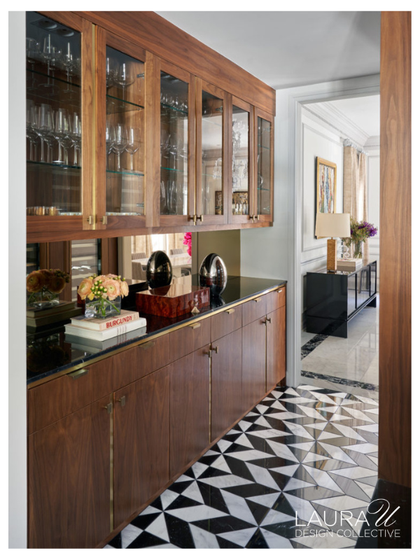 Walnut butler's pantry with glass cabinets and custom storage for serving pieces and stemware.
