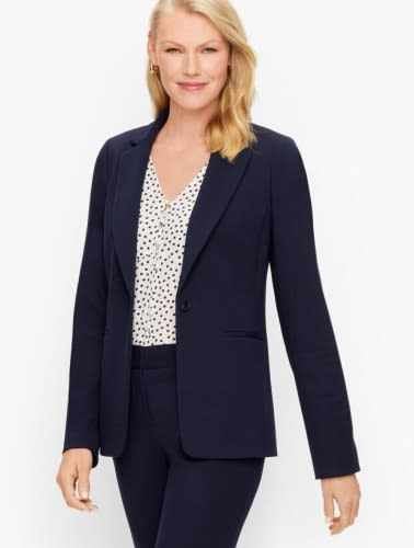 If you're the pants suit type, go bold with your blouse or choose a relaxed print for under your blazer.