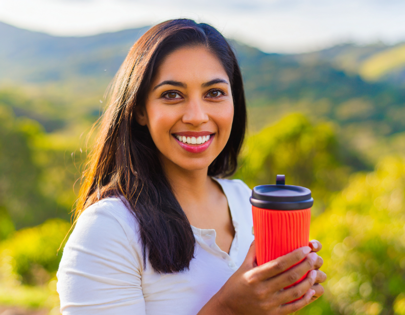 Women holding eco-freindly travel mug - products - ranges