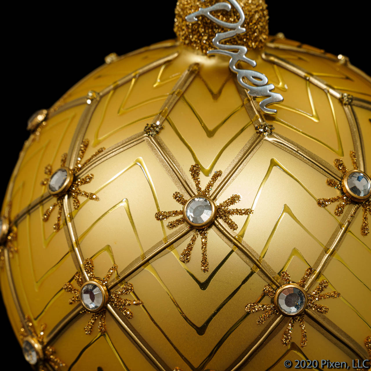 Sol is a golden glass Christmas ornament with rhinestones from the House of Pixen