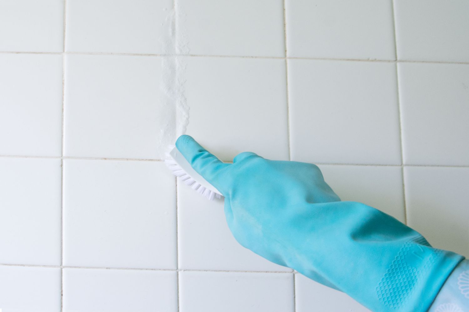 Scrub the grout lines with a brush