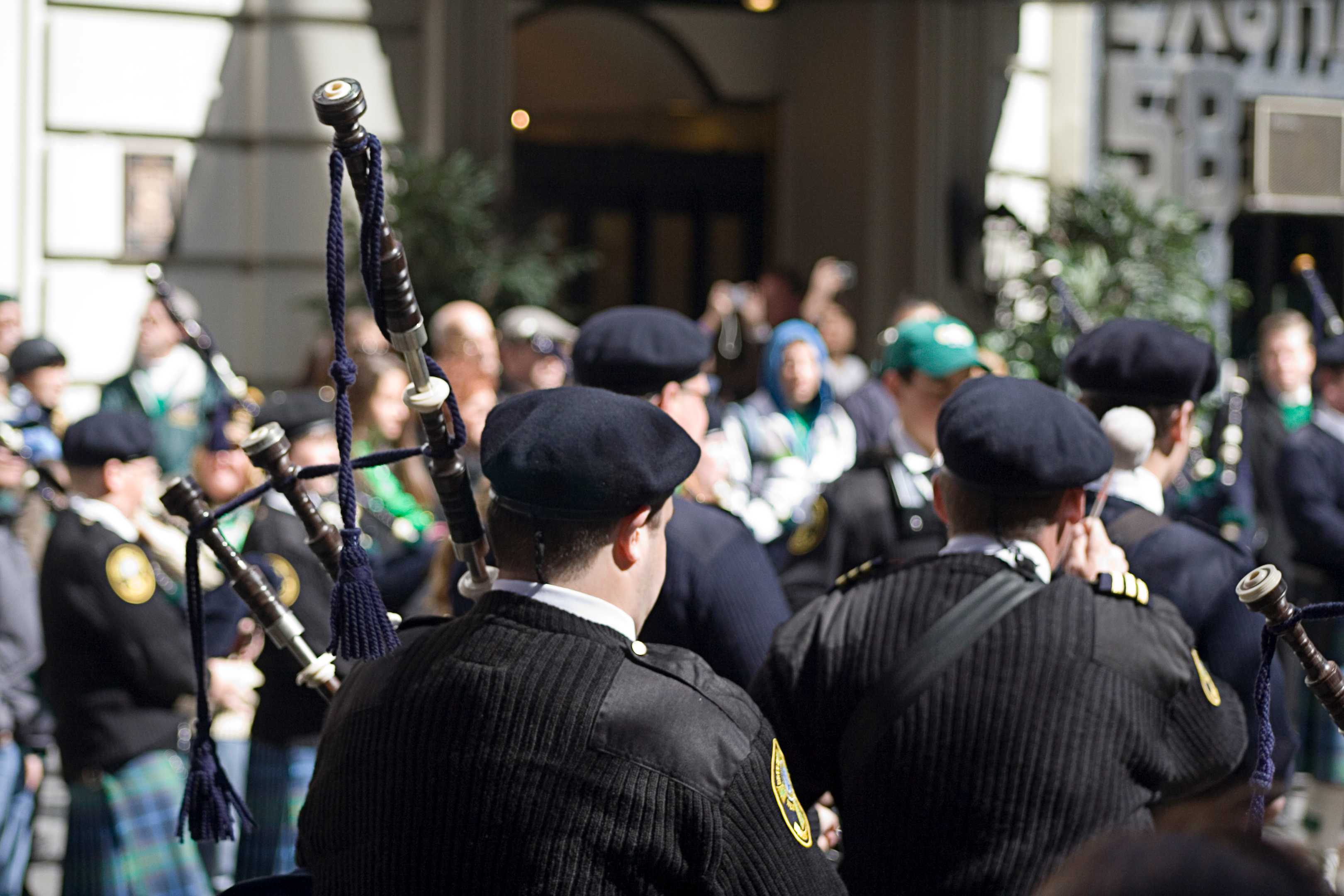 People playing bagpipes at a St. Patrick's Day parade