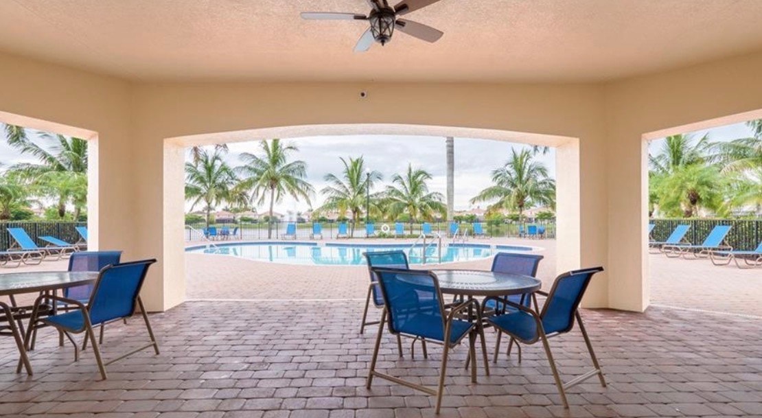 An aerial view of Catalina Isles in Fort Myers showcases the layout of the gated community, featuring three serene lakes surrounded by beautifully designed homes. This image highlights the attractive properties available for sale in Catalina Isles, ideal for those seeking a tranquil living environment in South Fort Myers.