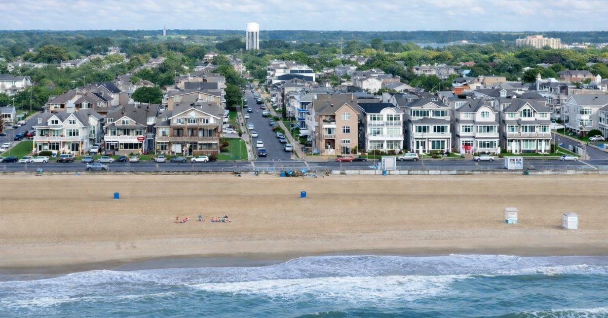 Aerial view of Belmar beachfront homes and sandy beach along the Jersey Shore.