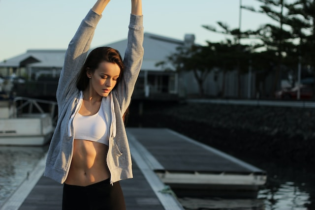 Woman exercising as a way to avoid burnout. (An important want to protect your energy)