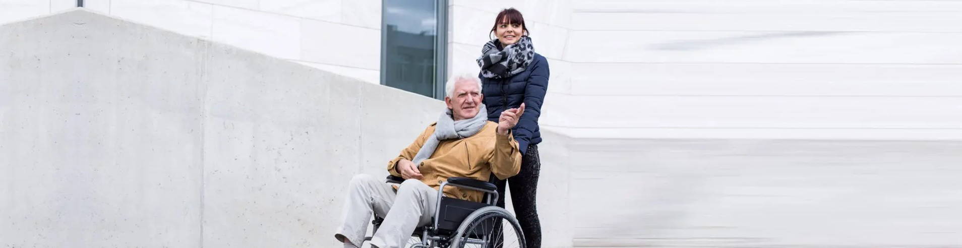 Man Being Pushed in Wheelchair