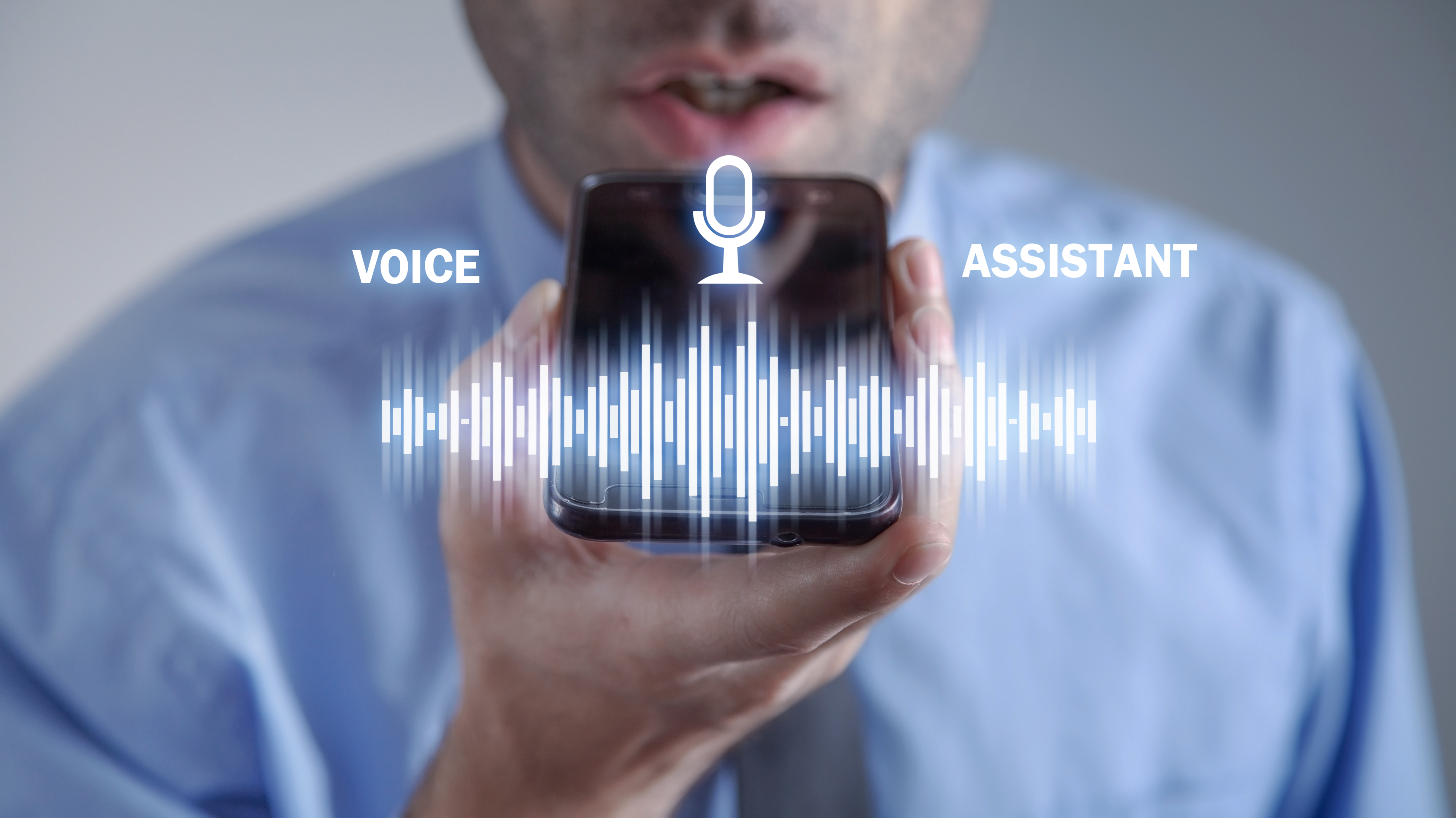 man-using-smartphone-voice-assistant
