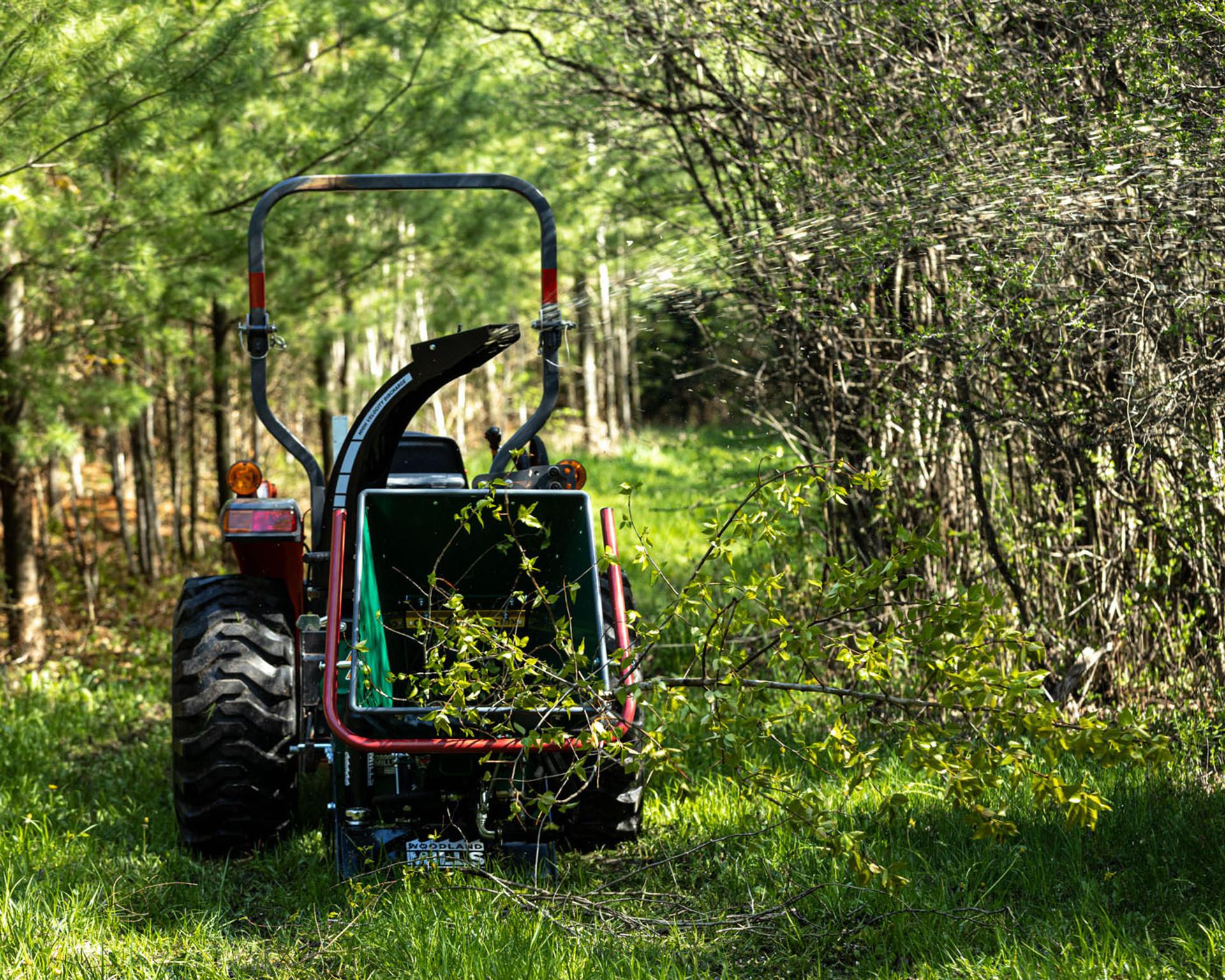 A Woodland Mills TF68 PRO Wood Chipper in a wood lot.