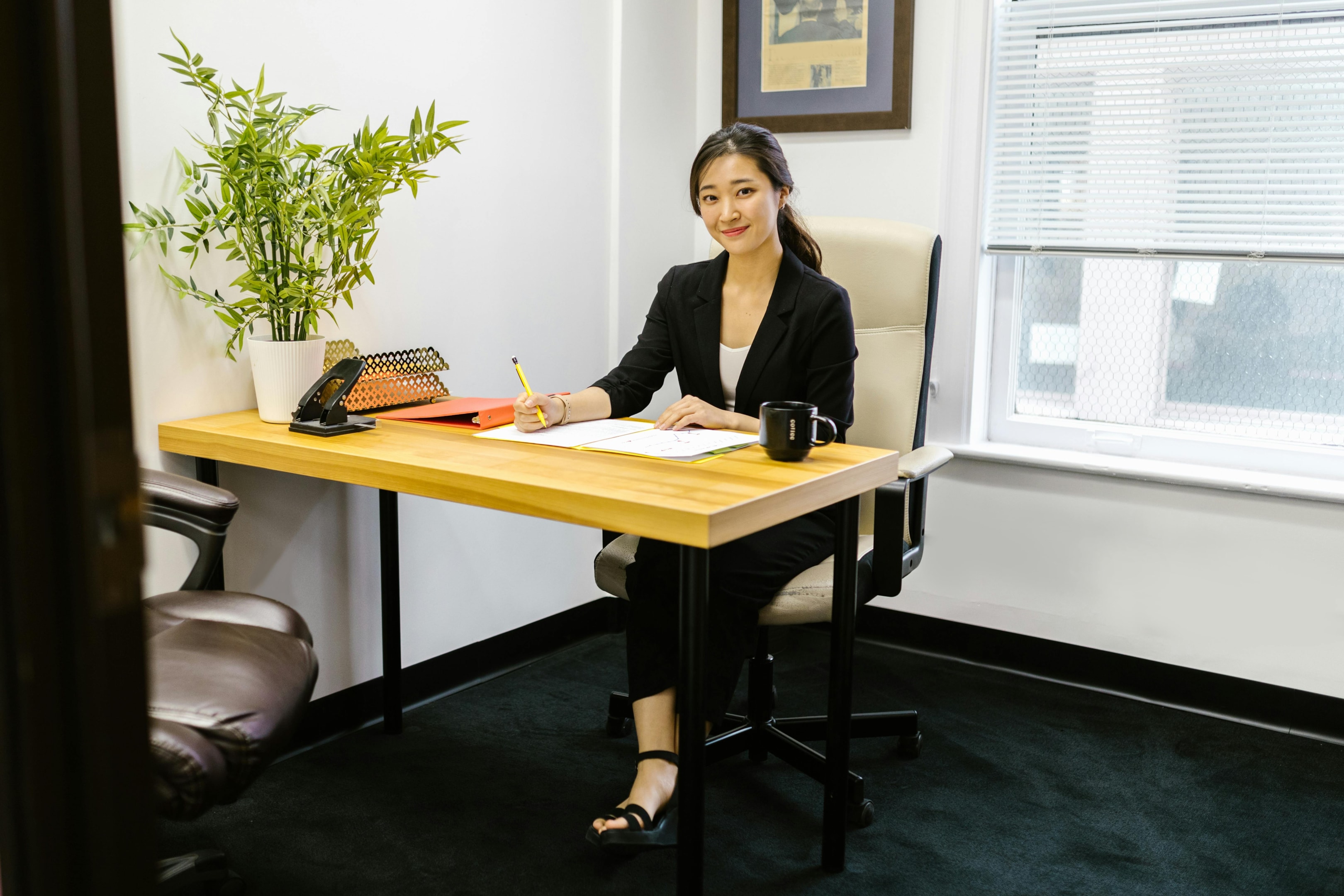 Real estate investor working in her office. 