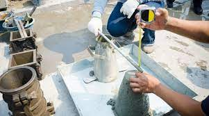 Preparation of concrete slump test equipment on a clean and level surface