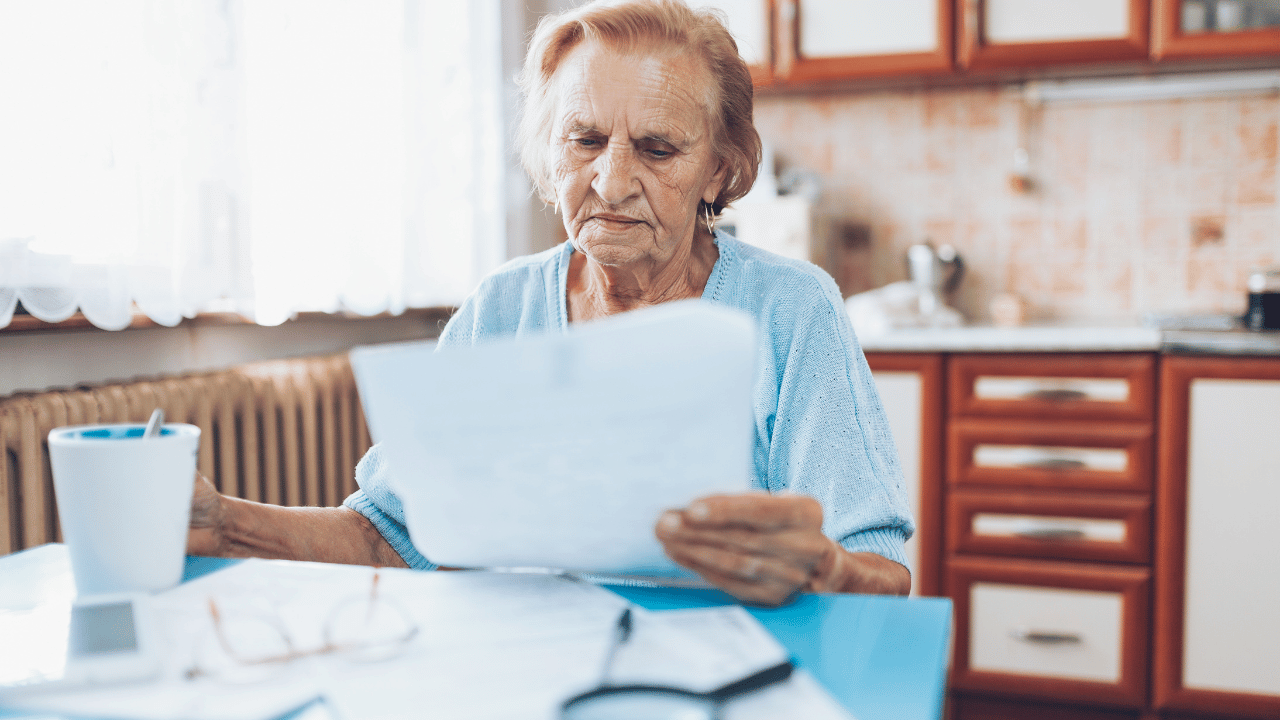 A person looking at a long-term care insurance policy