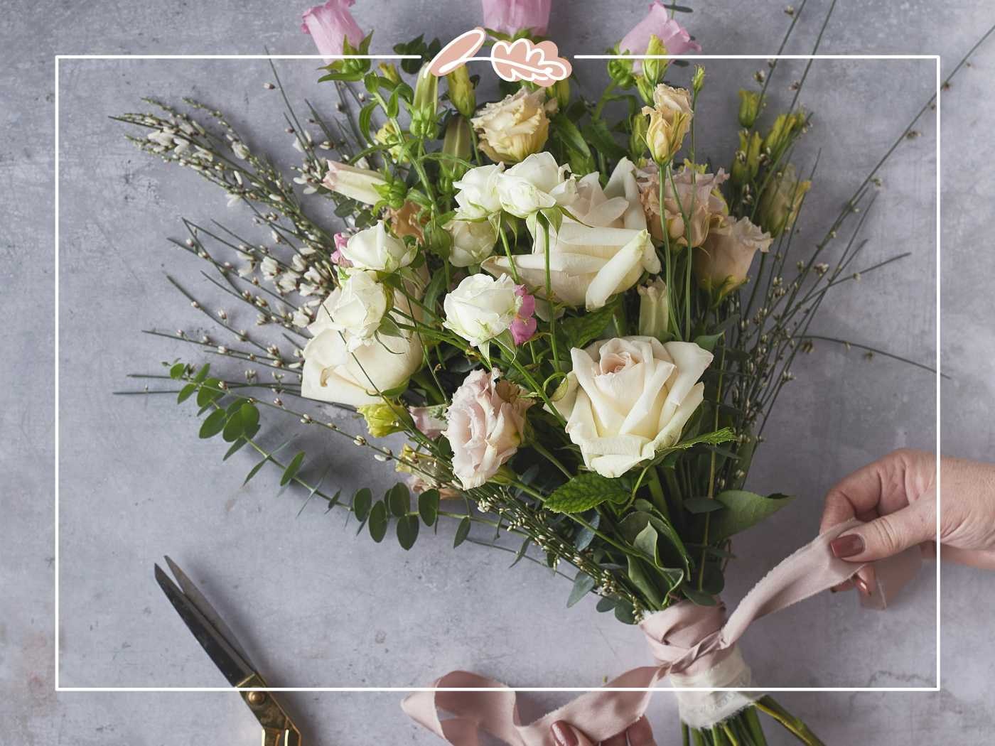 Beautifully wrapped bouquet of white and pink flowers by Fabulous Flowers and Gifts