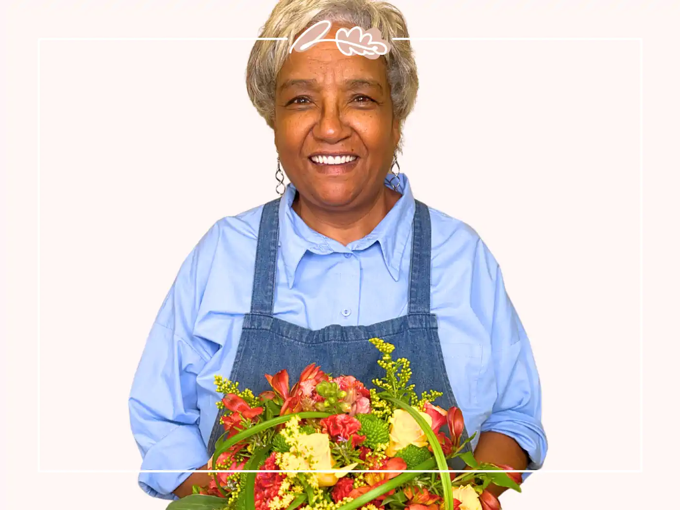 Happy woman holding a bouquet of red, yellow, and orange flowers. Fabulous Flowers and Gifts