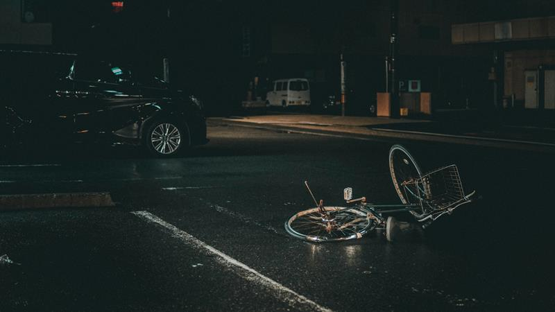 Abandoned bicycle in road accident at intersection