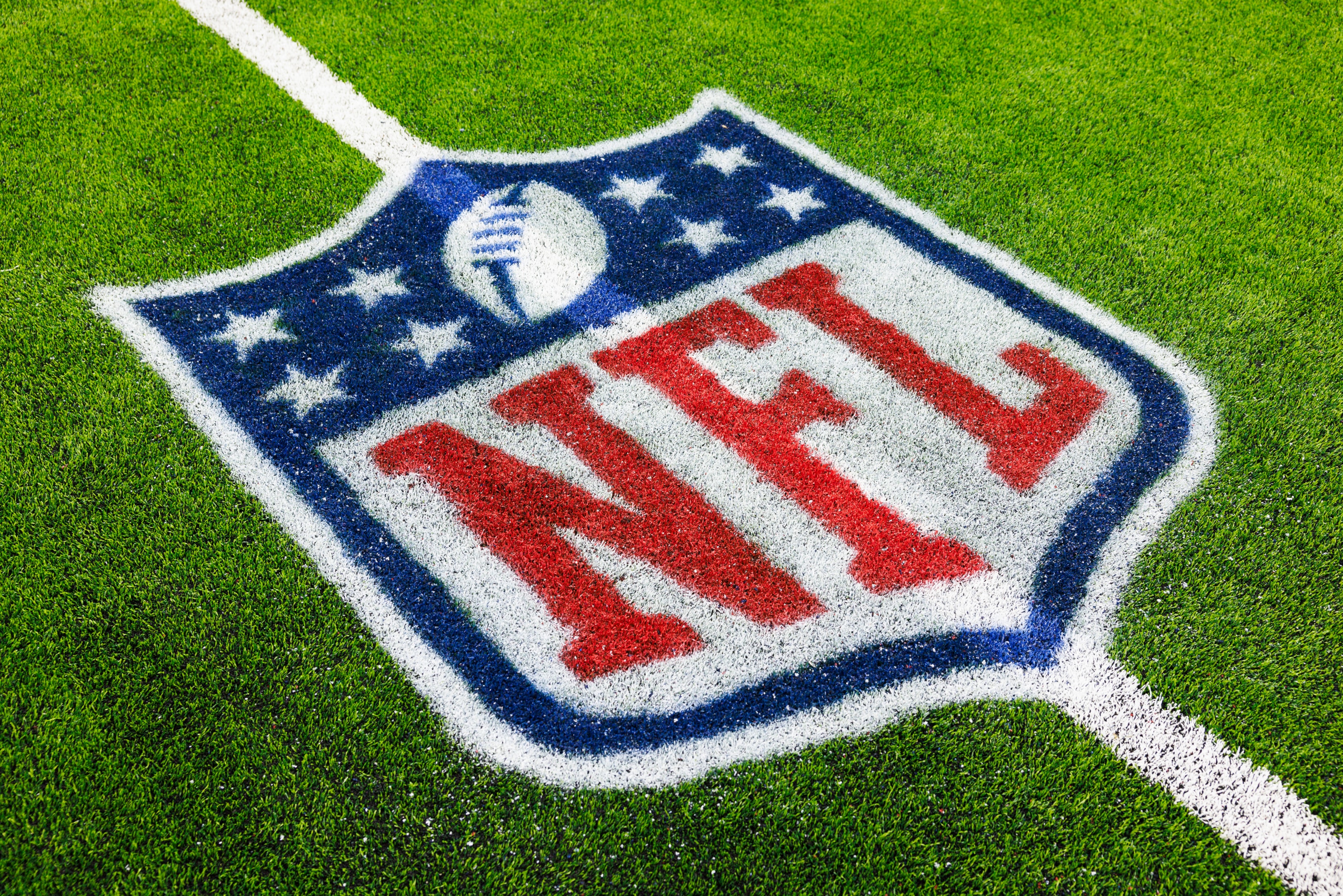 A view of a NFL shield logo painted on the field during a preseason game in Houston, Texas.