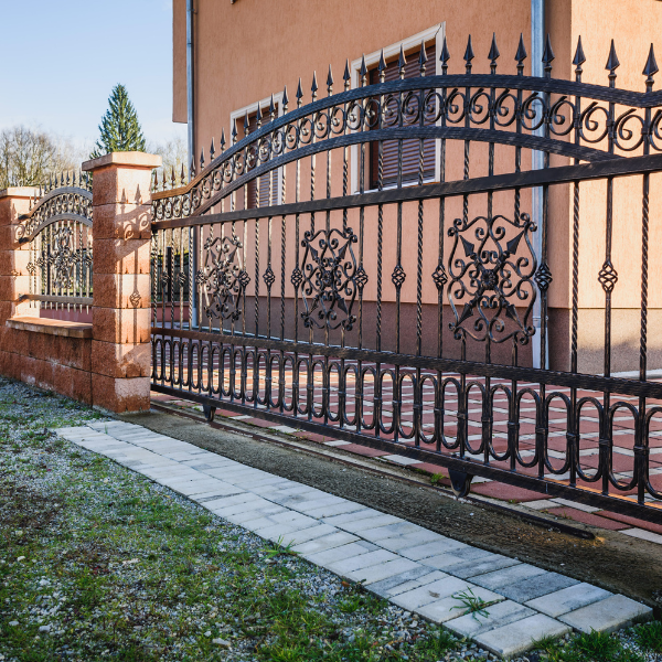 An image showing elegant wrought iron fencing with decorative patterns.