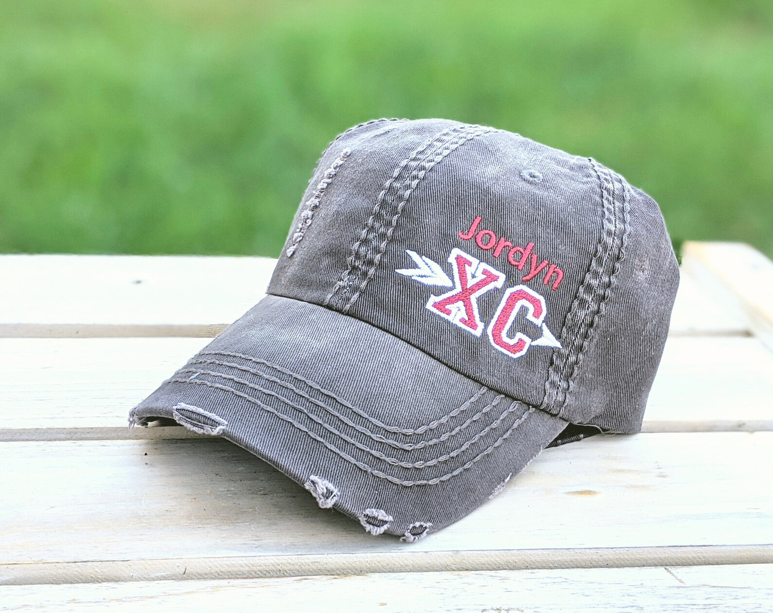 Cross country gifts like this super cute cap are fun reminders of your high school or college varsity team.