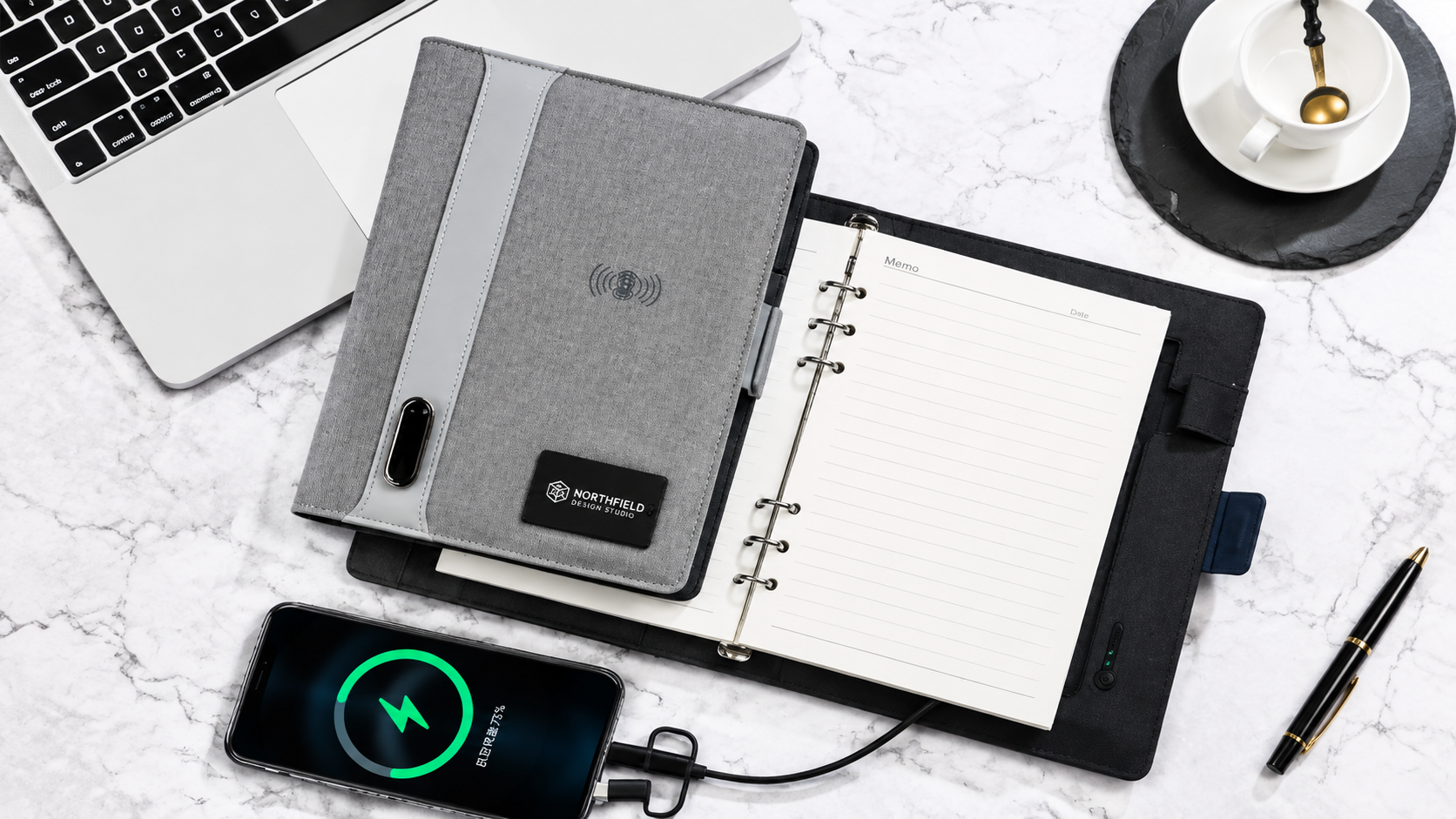 Multifunctional business notebook with card storage, pen holder, and phone charging cable
